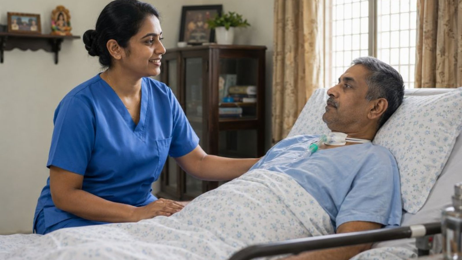 Home nurse sitting with an adult patient in a bright home living area