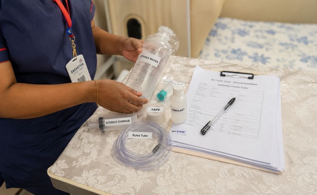 Nurse reviewing NG tube care supplies and documentation during a home visit
